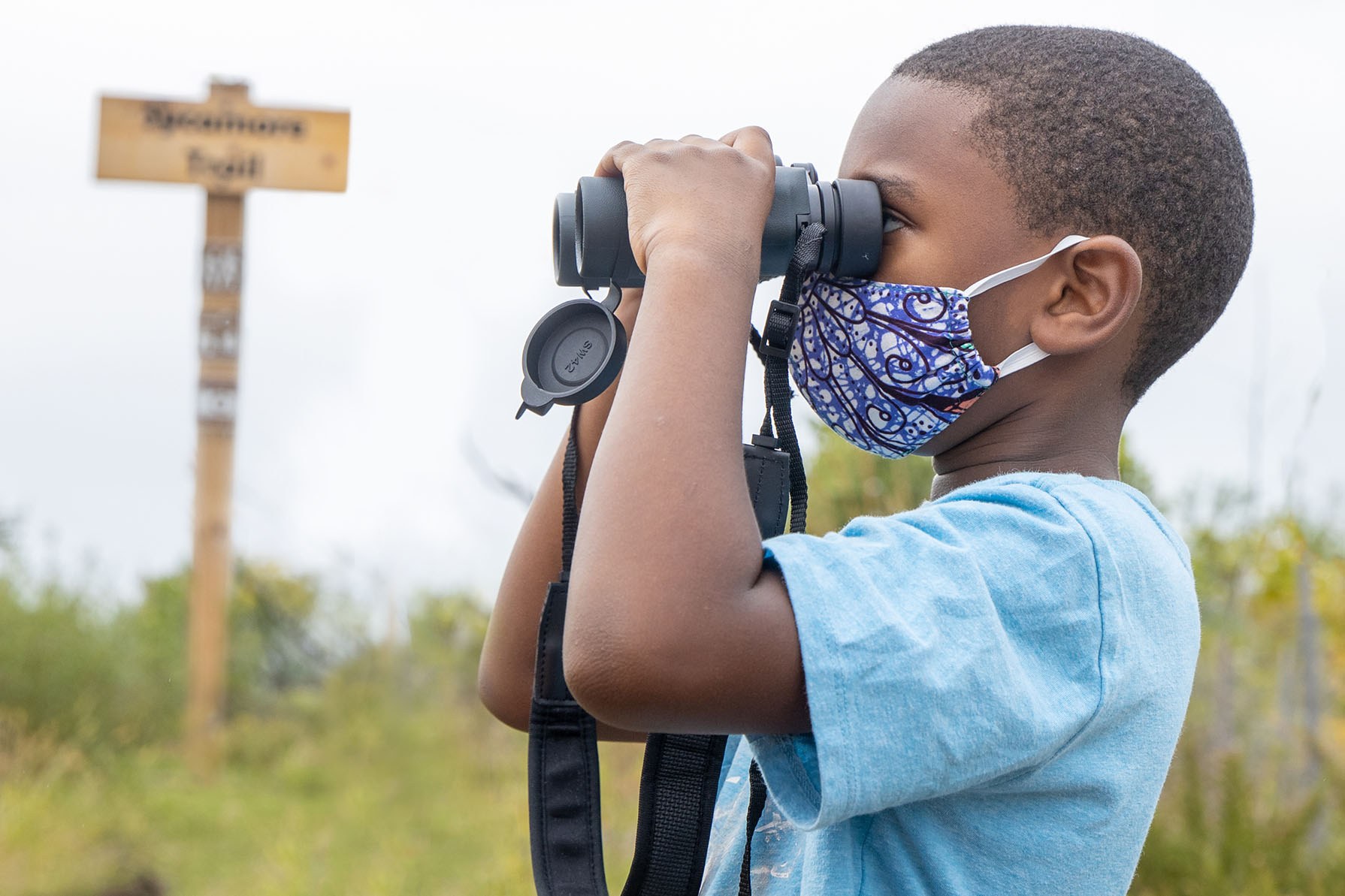 Young BioBlitz Participant Looks for Wildlife at Masonville Cove